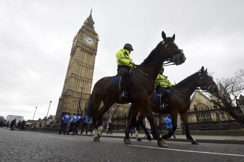 © Reuters. Police on horseback patrol near Westminster Bridge in London