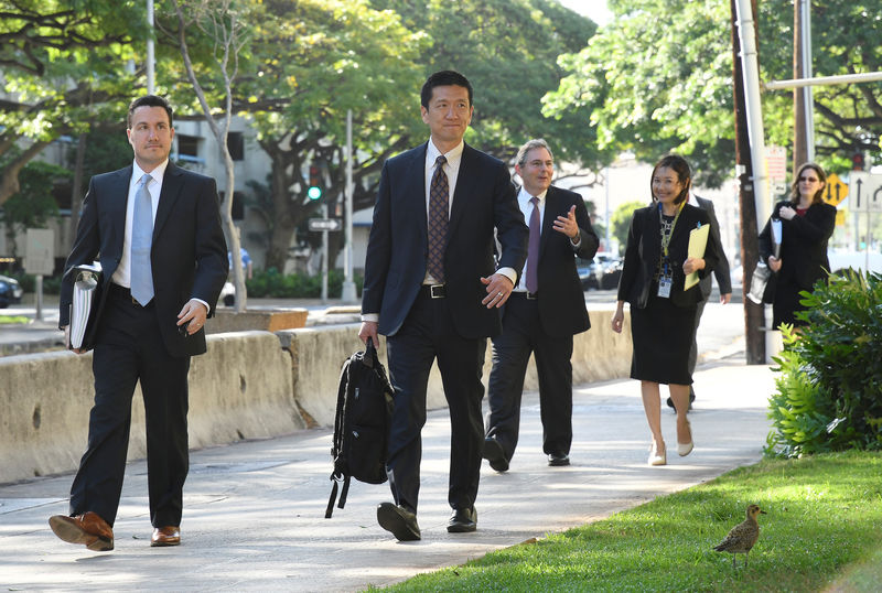 © Reuters. Hawaii Attorney General Douglas Chin arrives at the U.S. District Court Ninth Circuit to seek an extension after filing an amended lawsuit against President Donald Trump's new travel ban in Honolulu