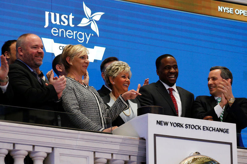 © Reuters. Just Energy Group Inc., Executive Chair Rebecca MacDonald and co-CEO Deborah Merril ring the opening bell at the NYSE