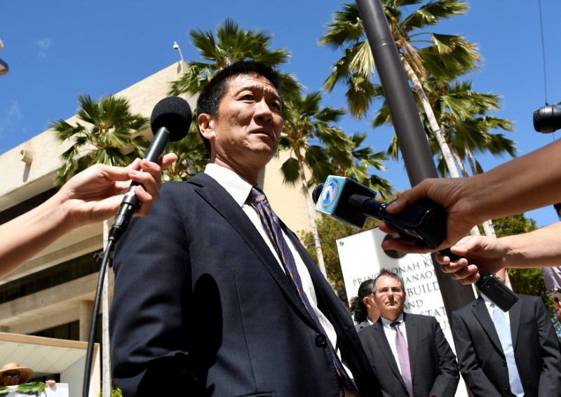 © Reuters. Hawaii Attorney General Douglas Chin talks to the media at the U.S. District Court Ninth Circuit after seeking an extension after filing an amended lawsuit against President Donald Trump's new travel ban in Honolulu