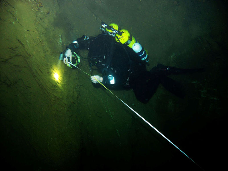 © Reuters. Undated handout photo of a diver searching for a new record depth at Hranice Abyss, already identified as the world's deepest underwater cave, near Hranice