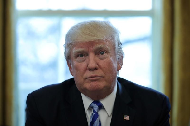 © Reuters. President Trump talks to journalists at the Oval Office of the White House after the AHCA health care bill was pulled before a vote in Washington