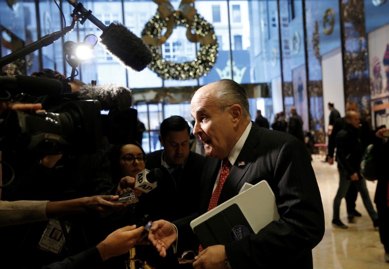 © Reuters. Former New York City Mayor Rudolph Giuliani speaks to members of the news media after meeting with U.S. President-elect Donald Trump at Trump Tower in New York