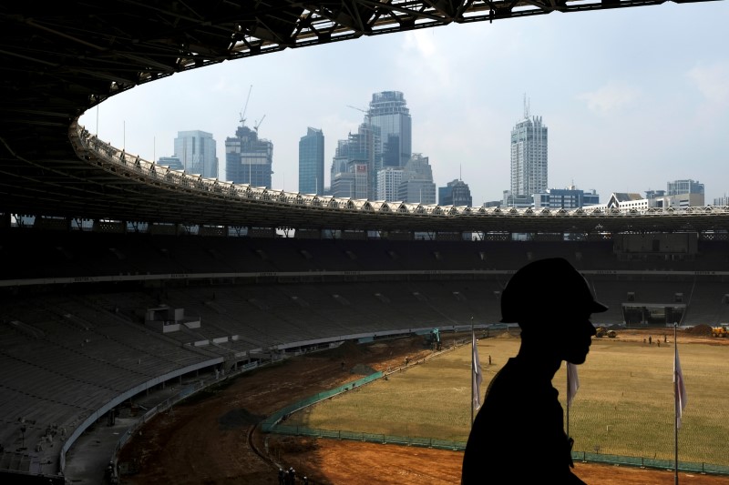 © Reuters. A worker walks during renovation of the Bung Karno stadium ahead for 2018 Asian Games in Jakarta