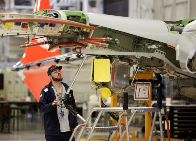 © Reuters. A Boeing worker is pictured in the wing system installation area at their factory in Renton, Washington