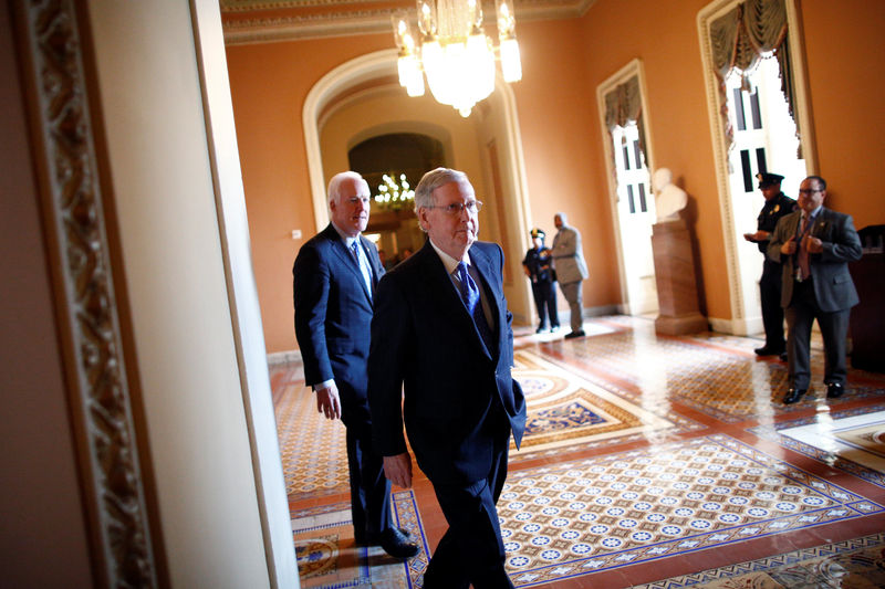 © Reuters. U.S. Senate Majority Leader Mitch McConnell (R-KY) walks to speak to reporters after the weekly Republican caucus policy luncheon at the U.S. Capitol in Washington