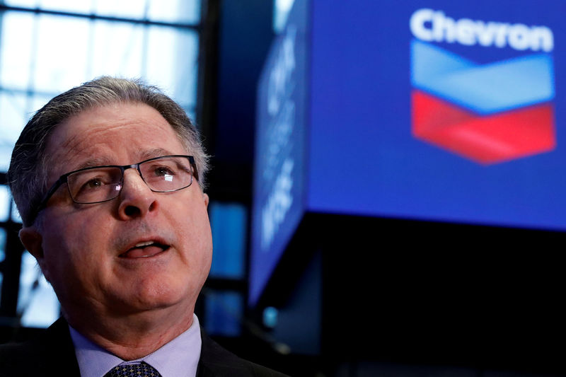 © Reuters. FILE PHOTO: John Watson, Chevron's chairman and CEO, speaks during an interview on the floor of the NYSE in New York