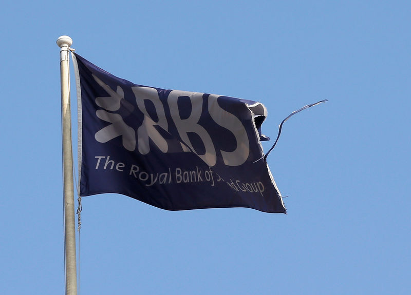 © Reuters. FILE PHOTO: A flag flies above the head office of RBS in St Andrew Square in Edinburgh