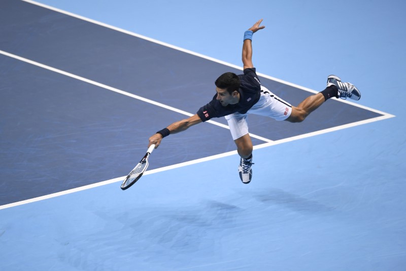 © Reuters. Serbia's Novak Djokovic in action during his round robin match with Belgium's David Goffin