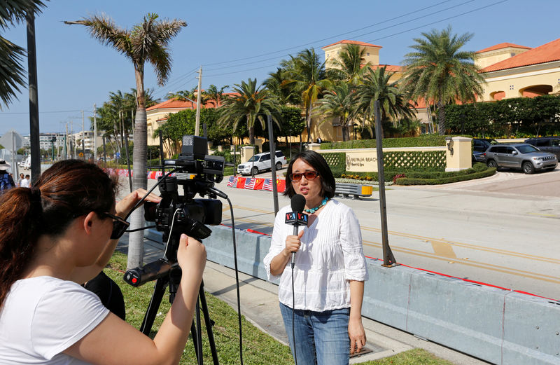 © Reuters. A Voice of America crew reports in front of the  Eau Palm Beach Resort and Spa where President of China Xi Jinping will stay in Manalapan