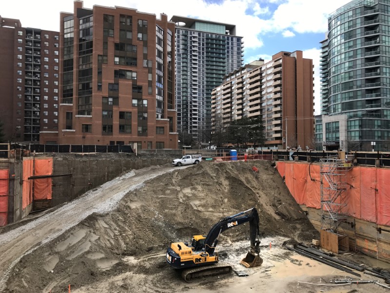 © Reuters. Construction equipment is parked at the bottom of a pit on the site of a new condominium complex in Toronto