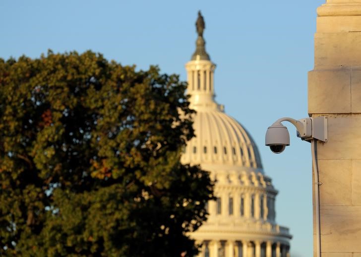 © Reuters. A security camera hangs near the U.S. Capitol in Washington