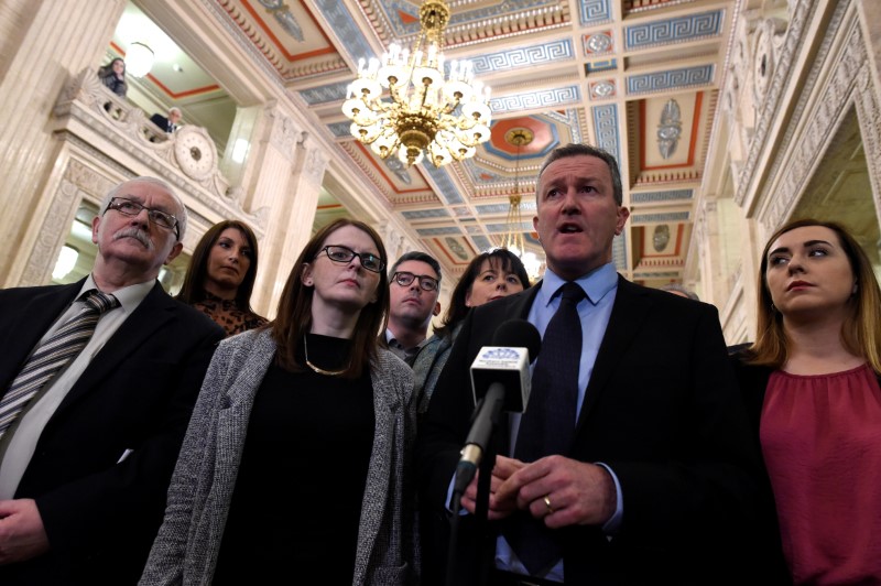 © Reuters. Sinn Fein's Conor Murphy speaks to media at Stormont Parliament in Belfast