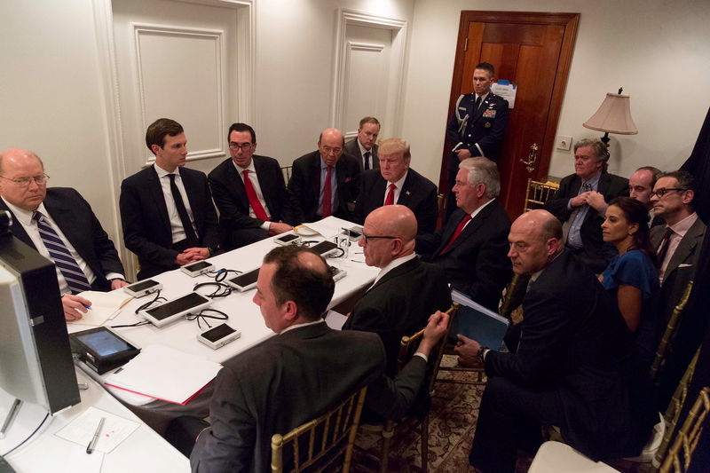 © Reuters. U.S. President Trump is shown in an official White House handout image meeting with his National  Security team at his Mar-a-Lago resort after a missile strike on Syria