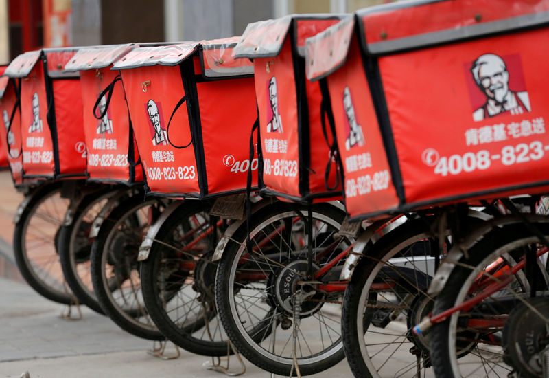 © Reuters. FILE PHOTO: Logos of KFC, owned by Yum Brands Inc, are seen on its delivery bicycles in front of its restaurant in Beijing