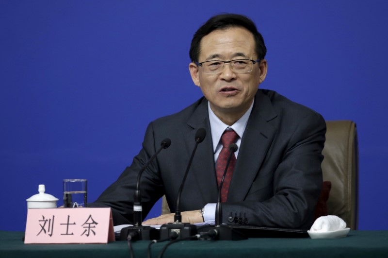 © Reuters. FILE PHOTO - Liu Shiyu, Chairman of CSRC, attends a news conference on the sidelines of the NPC in Beijing