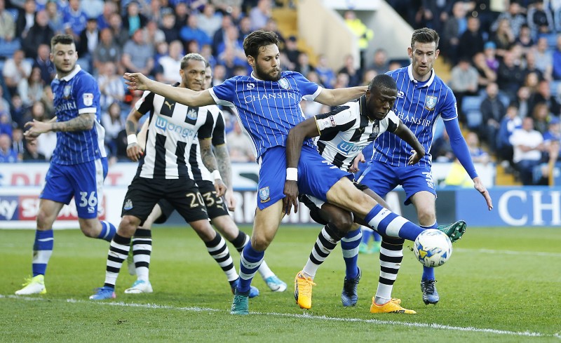 © Reuters. Chancel Mbemba of Newcastle United in action with Vincent Sasso of Sheffield Wednesday