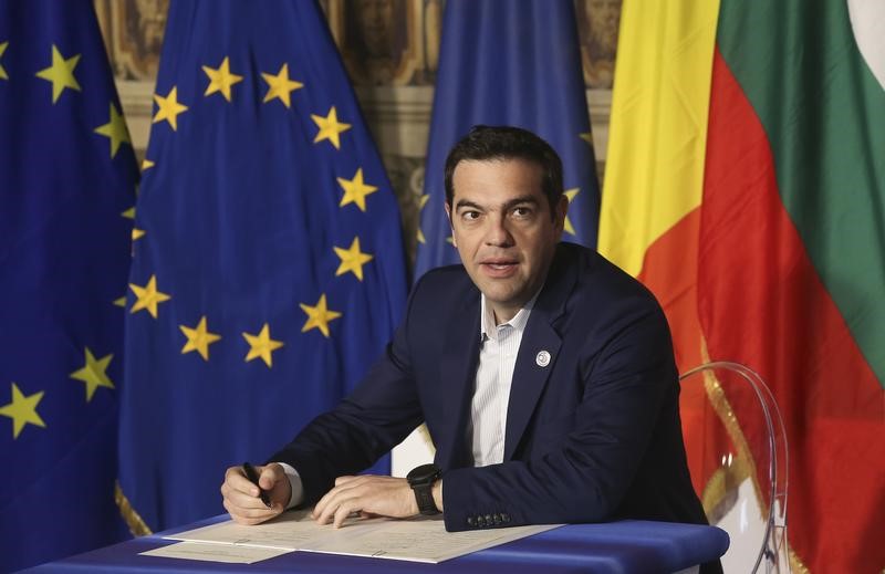 © Reuters. Greek PM Tsipras signs a during the EU leaders meeting on the 60th anniversary of the Treaty of Rome, in Rome