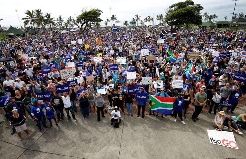 © Reuters. Demonstrators take part in a protest calling for the removal of South Africa's President Jacob Zuma in Durban