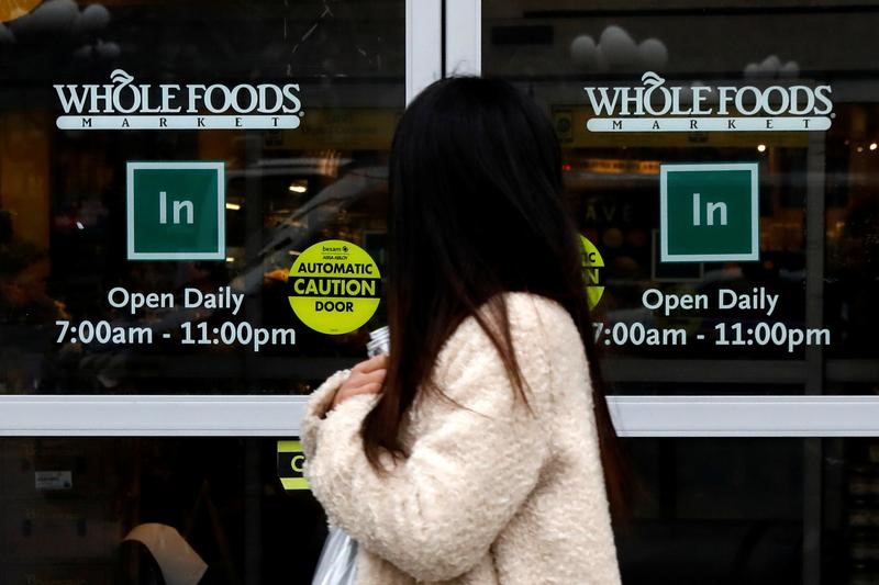 © Reuters. A customer exits a Whole Foods Market in New York