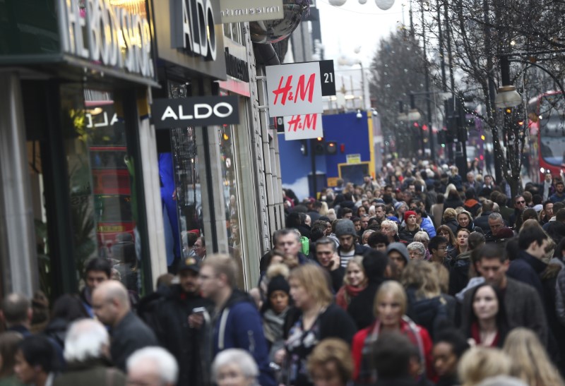 © Reuters. File photo of shoppers walking along Oxford Street in London