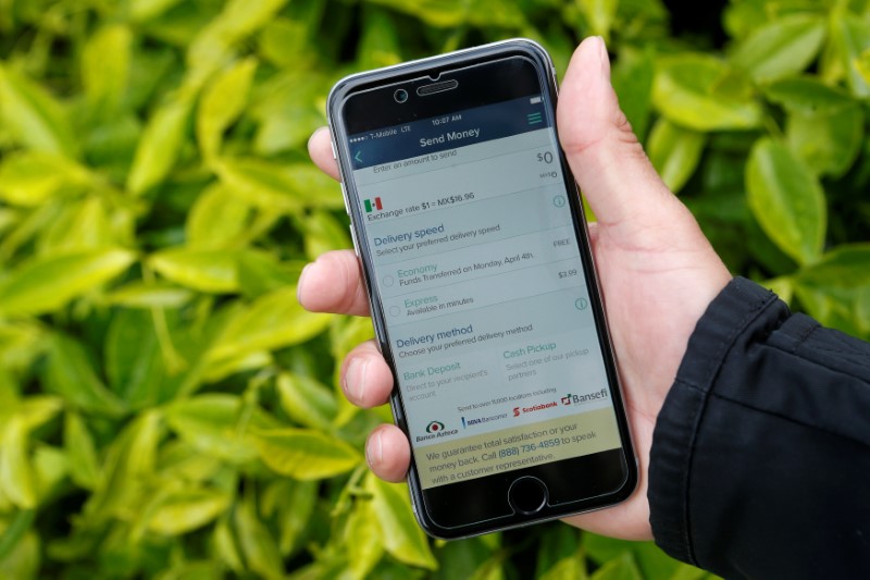 © Reuters. FILE PHOTO: Noe Sanchez shows off the Remitly app that he uses to send money to his family in Mexico in this photo taken in San Francisco, California