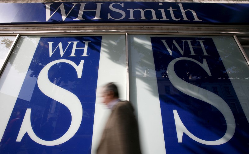 © Reuters. File photo of pedestrians walking past a WH Smith shop in London