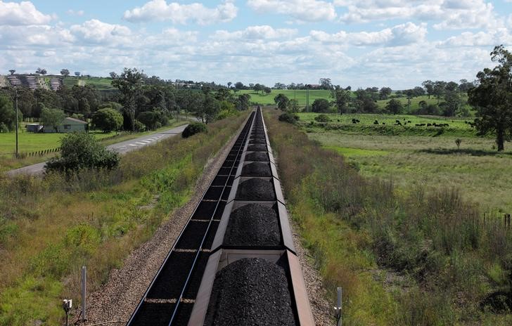 © Reuters. An Aurizon coal train travels through the countryside in Muswellbrook, north of Sydney, Australia