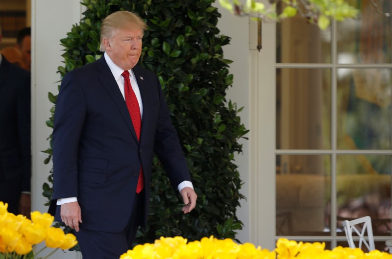 © Reuters. U.S. President Donald Trump arrives for the swearing in ceremony of Judge Neil Gorsuch as an Associate Supreme Court Justice in the Rose Garden of the White House in Washington