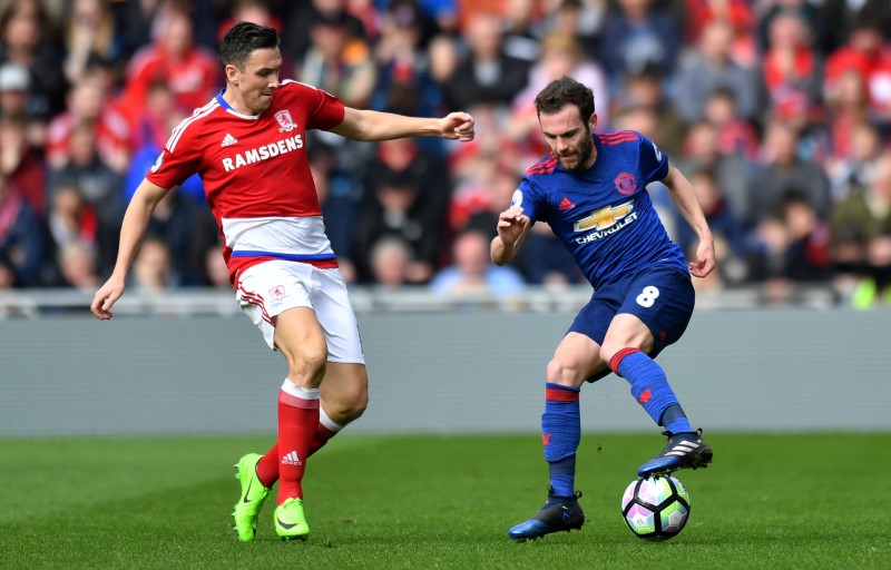 © Reuters. Manchester United's Juan Mata in action with Middlesbrough's Stewart Downing