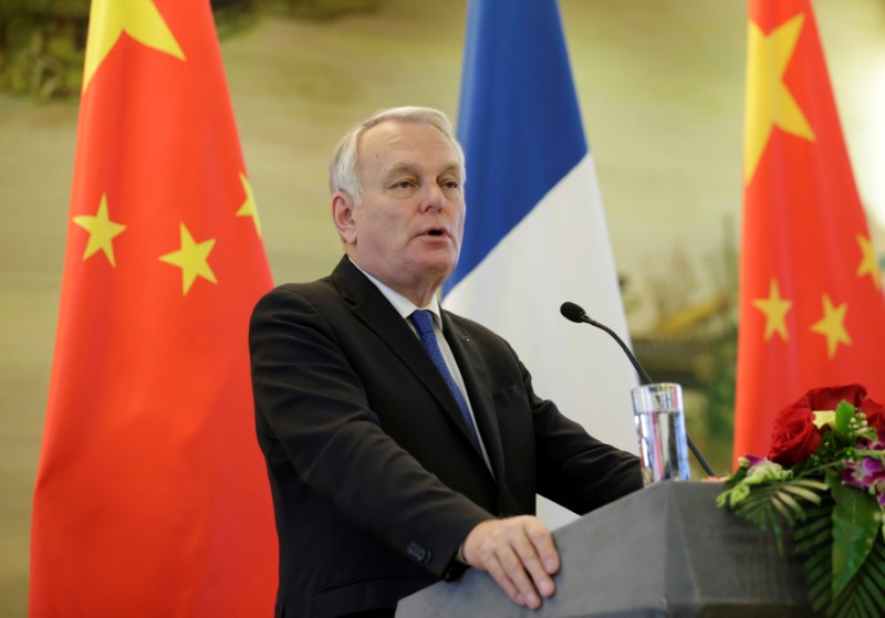 © Reuters. French Foreign Minister Jean-Marc Ayrault attends a joint news conference in Beijing