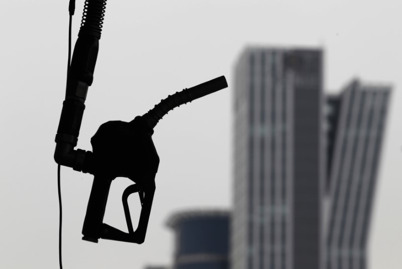 © Reuters. A gasoline pump is seen hanging at a petrol station in central Seoul