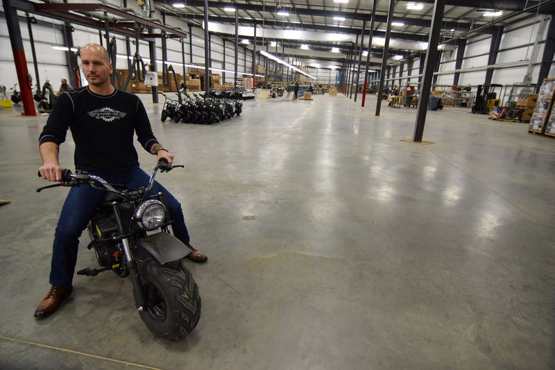 © Reuters. Alex Keechle, CEO of Mini motorcycle and go-kart maker Monster Moto, poses on the factory floor in Ruston
