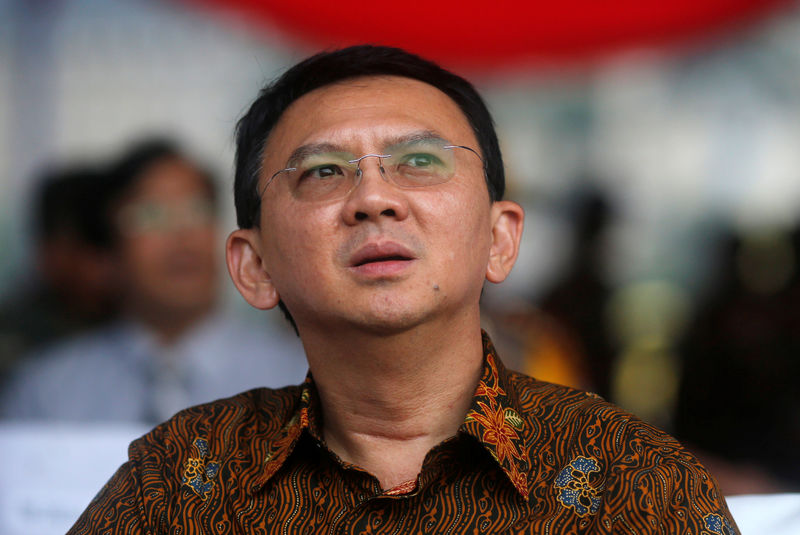 © Reuters. Basuki Tjahaja Purnama, the candidate in Jakarta governor election looks on during Peace Declaration ceremony for Wednesday election in Jakarta