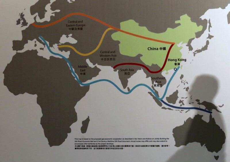 © Reuters. The shadow of a participant is seen on a map illustrating China's "One Belt, One Road" megaproject at the Asian Financial Forum in Hong Kong