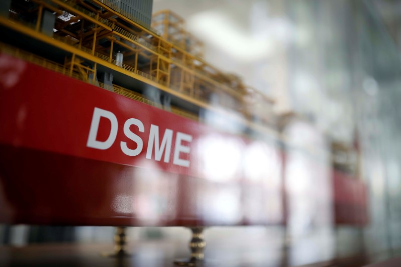 © Reuters. The name of Daewoo Shipbuilding & Marine Engineering Co is seen on a replica ship displayed at its building in Seoul