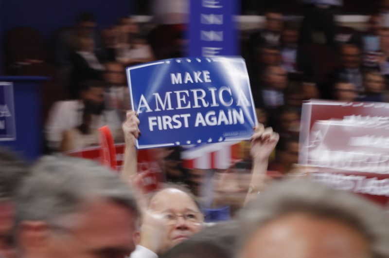 © Reuters. A delegate waves a sign on the floor during the third session of the Republican National Convention in Cleveland