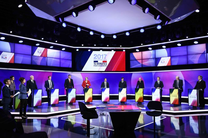© Reuters. The eleven French presidential election candidates take part in a special political television show entitled "15min to Convince" at the studios of French Television channel France 2 in Saint-Cloud