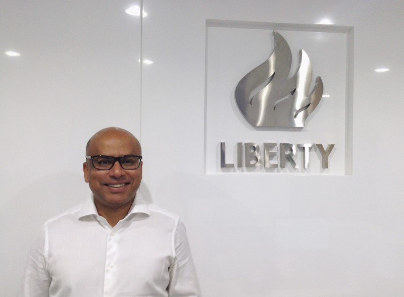 © Reuters. Sanjeev Gupta, executive chairman of Liberty House Group, poses for a photo at the companyÕs Dubai office