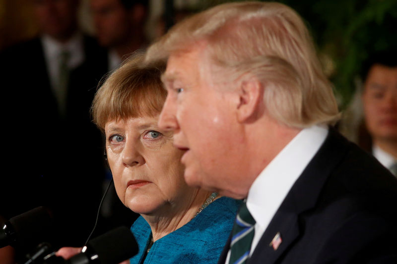 © Reuters. Merkel and Trump hold a joint news conference in the East Room of the White House in Washington