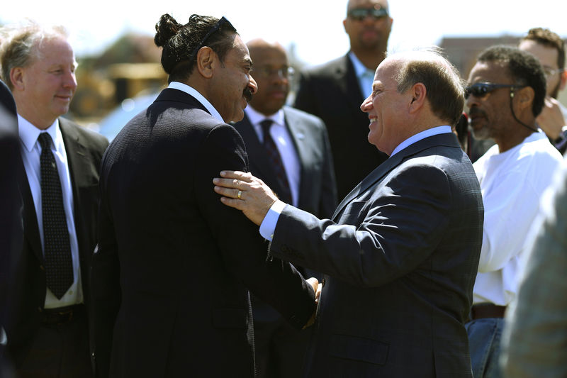 © Reuters. Flex-N-Gate owner and businessman Khan greets Detroit Mayor Duggan before a groundbreaking ceremony for a Flex-N-Gate manufacturing facility in the I-94 Industrial Park in Detroit