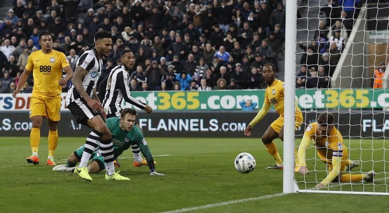 © Reuters. Preston's Paul Gallagher handles the ball and concedes a penalty