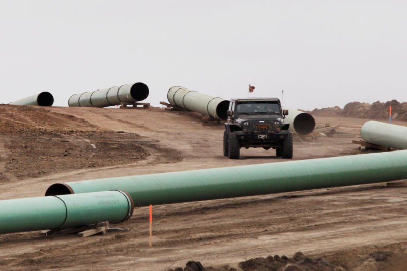 © Reuters. FILE PHOTO: A vehicle drives next to a series of pipes at a Dakota Access Construction site near the town of Cannon Ball