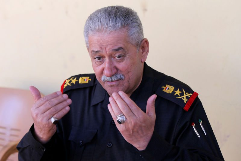 © Reuters. Major General Abdul Ghani al-Asadi a commander of the Counter Terrorism Service speaks with Reuters reporter in western Mosul