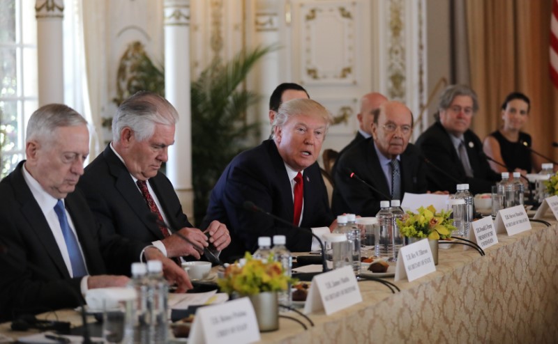 © Reuters. U.S. President Trump  sits with members of his cabinet during bilateral meeting with China's President Xi at Trump's Mar-a-Lago estate in Palm Beach