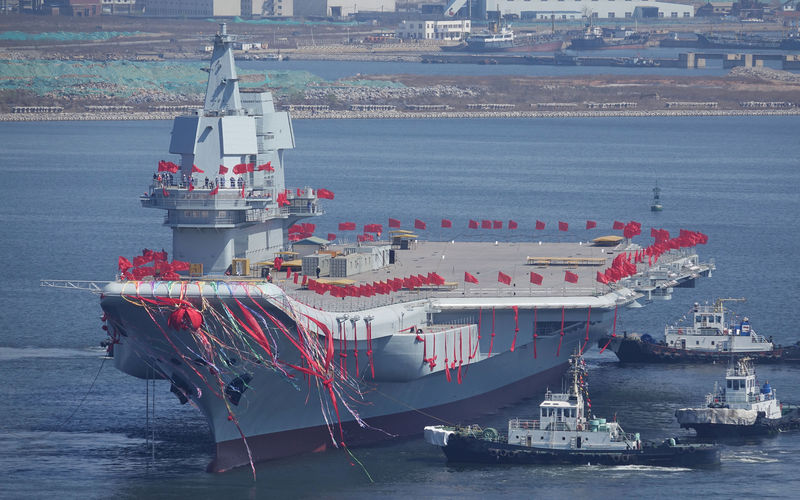 © Reuters. China's first domestically built aircraft carrier is seen during its launching ceremony in Dalian