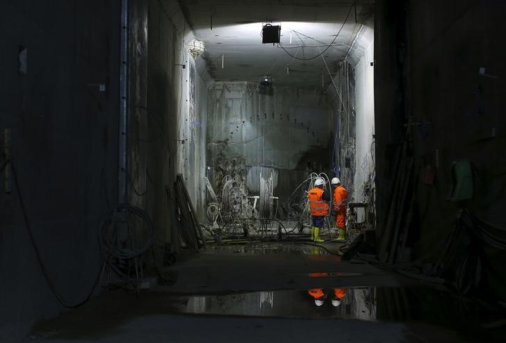 © Reuters. A file photo of workers are seen at the site of a metro railway tunnel under construction at the 