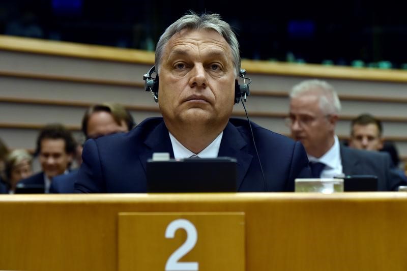 © Reuters. Hungary's PM Orban looks up during a plenary session at the EP in Brussels