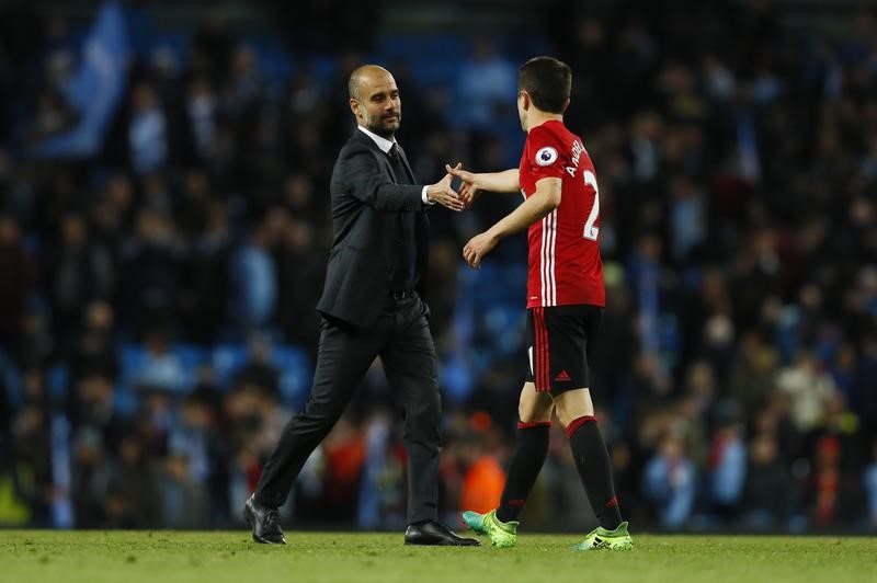 © Reuters. Manchester City manager Pep Guardiola Manchester United's Ander Herrera at the end of the match