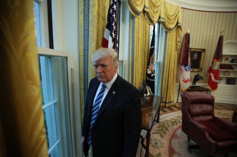© Reuters. U.S. President Donald Trump stands in the Oval Office following an interview with Reuters at the White House in Washington